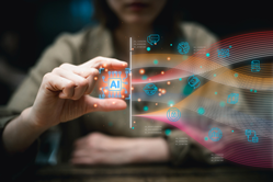 Stylized image of a person holding up an AI chip