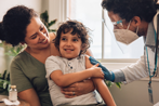 Young child getting care from doctor