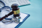 Gavel and Stethescope on top of medical record