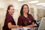 Two nurses at nursing station